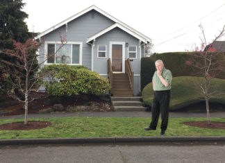 Neighbor Stands Vigil at Unmarked Curbside Parking Space