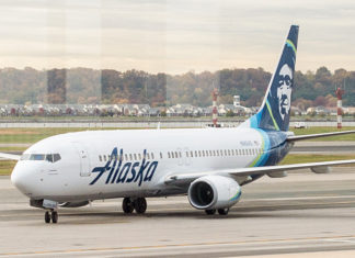 Alaska Airlines Logo Only Person Smiling at Sea-Tac
