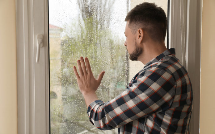 man rainy window1600